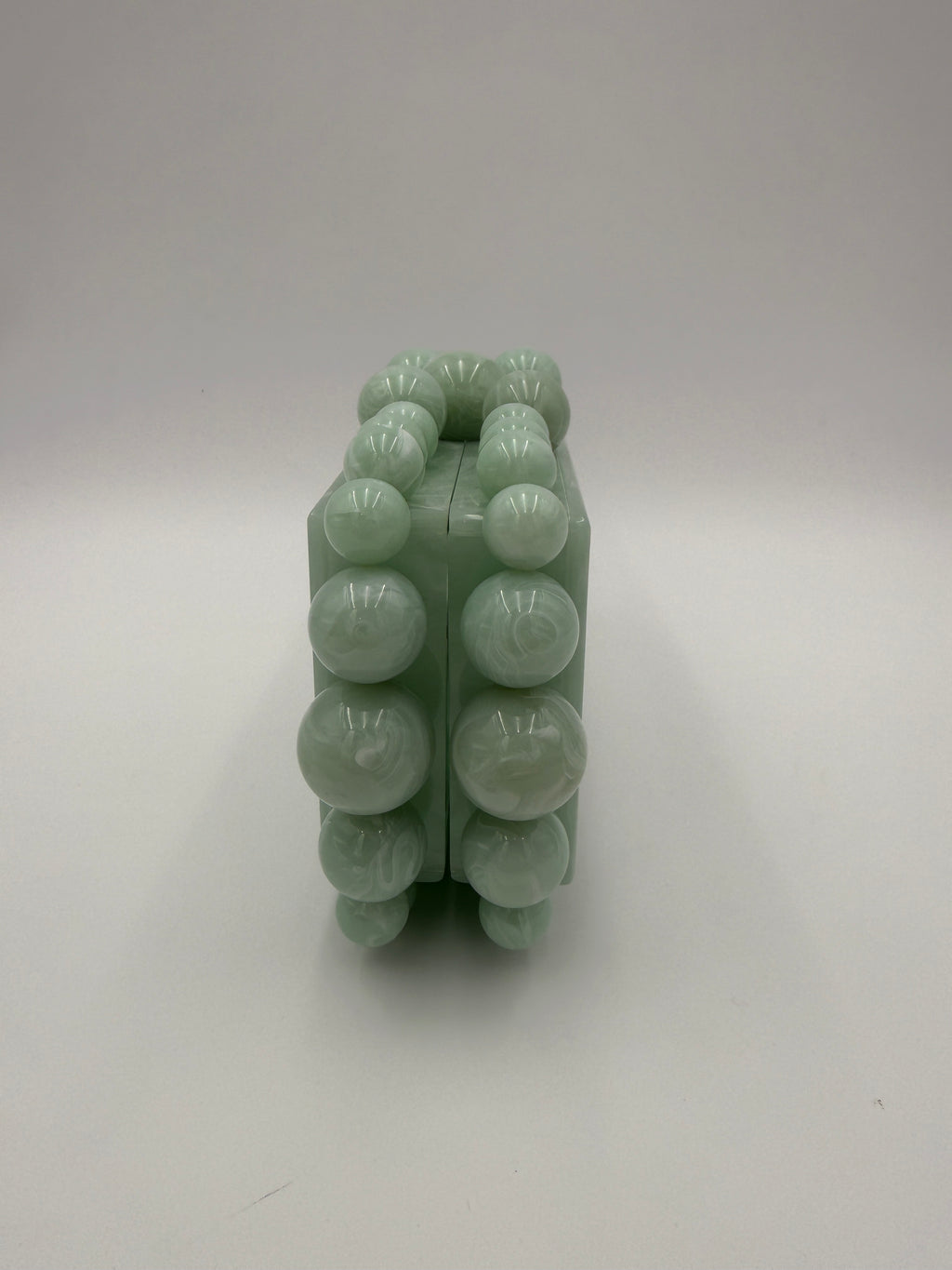 Cult Gaia Soft green acrylic clutch