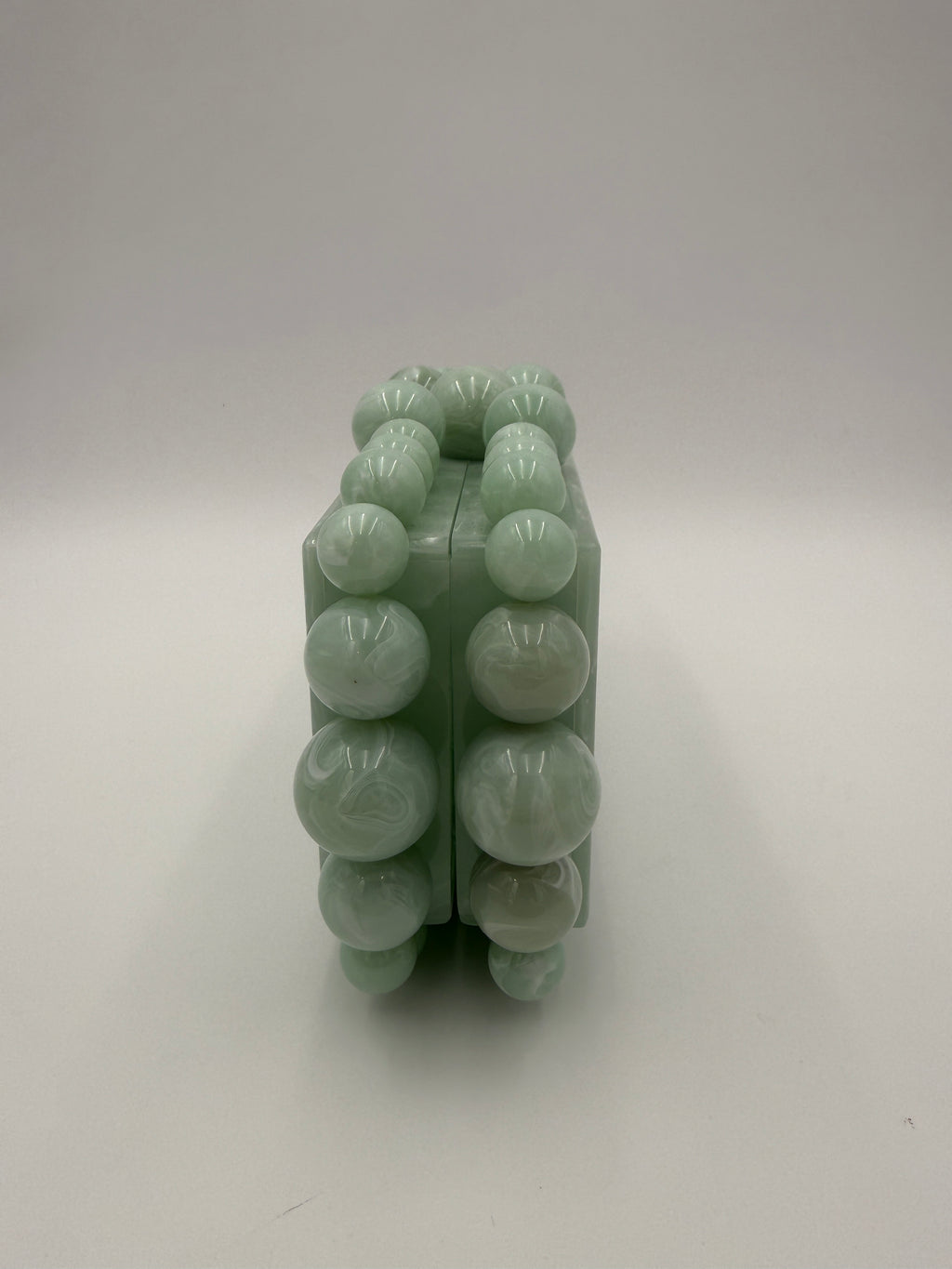 Cult Gaia Soft green acrylic clutch
