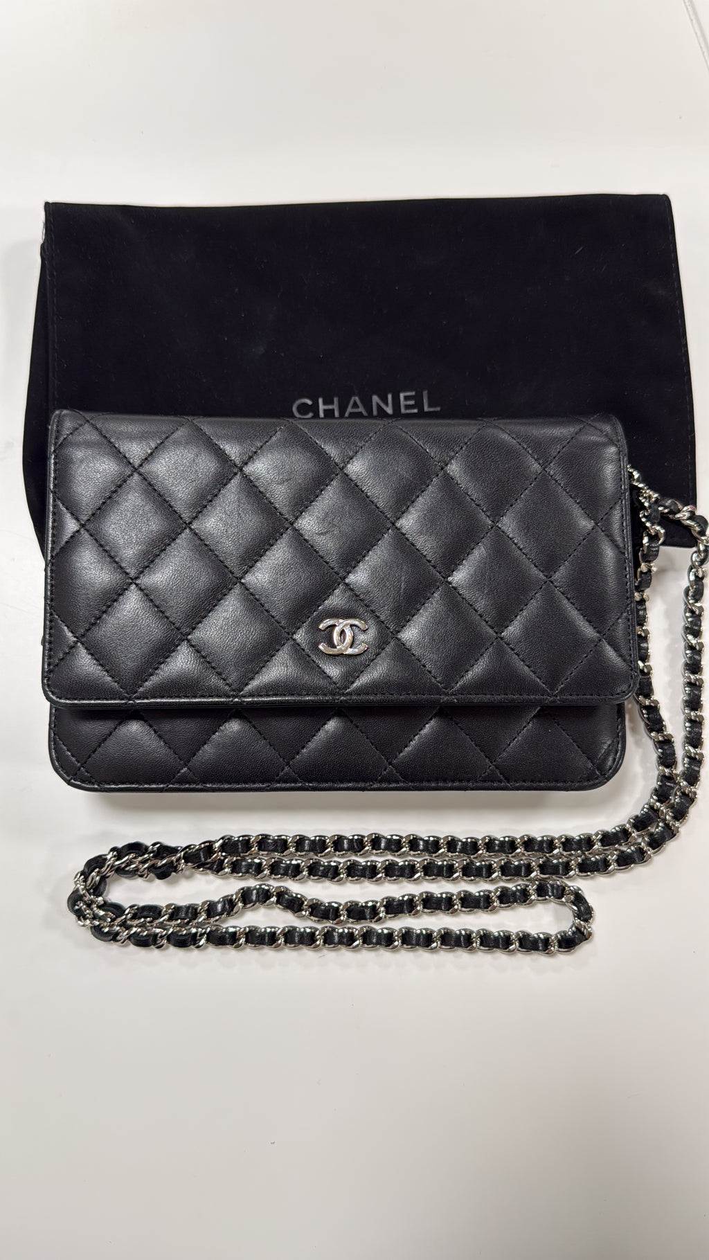 Chanel Black WOC with dust