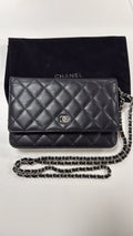 Chanel Black WOC with dust