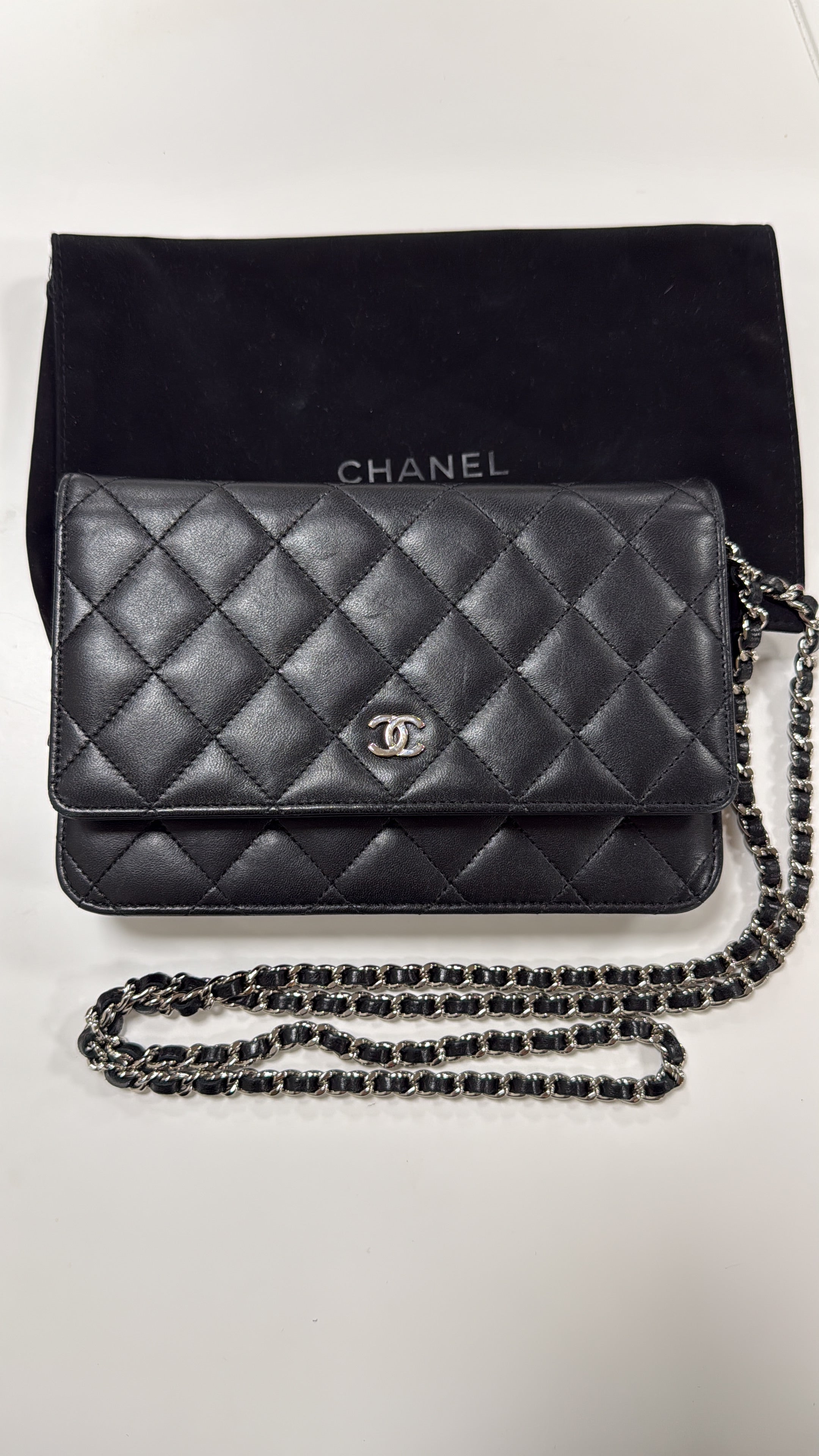 Chanel Black WOC with dust