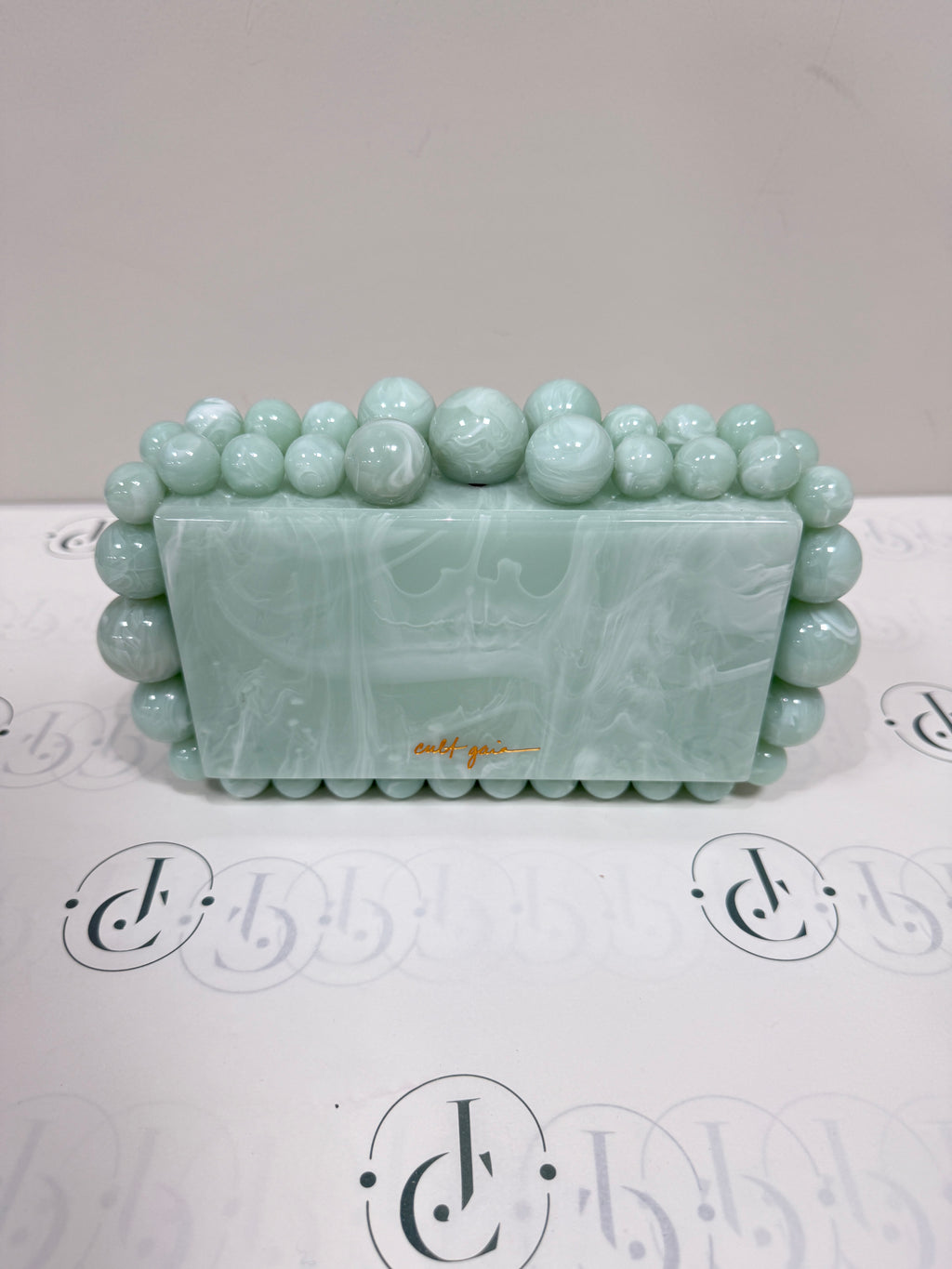 Cult Gaia Soft green acrylic clutch